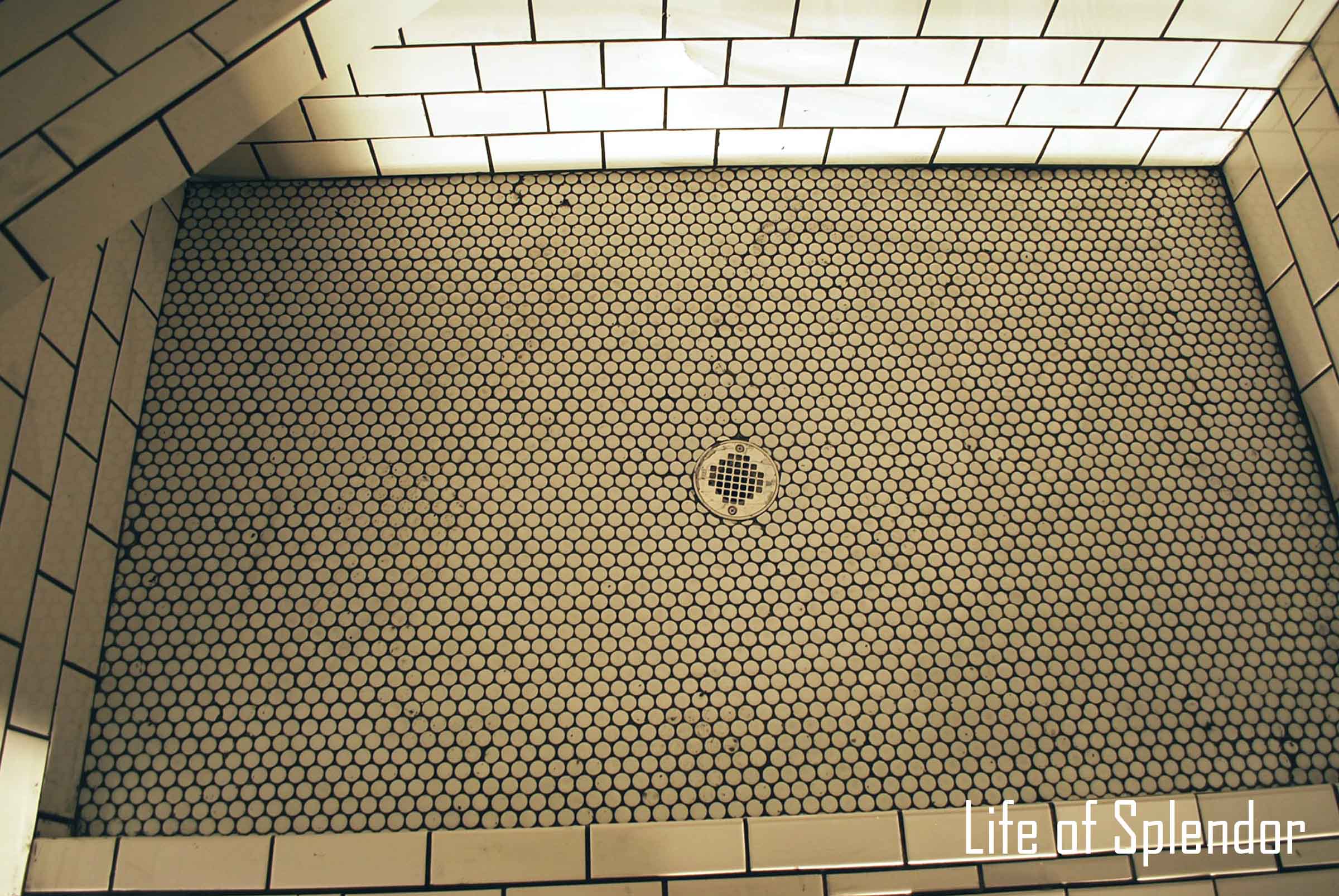 Penny tile shower floor