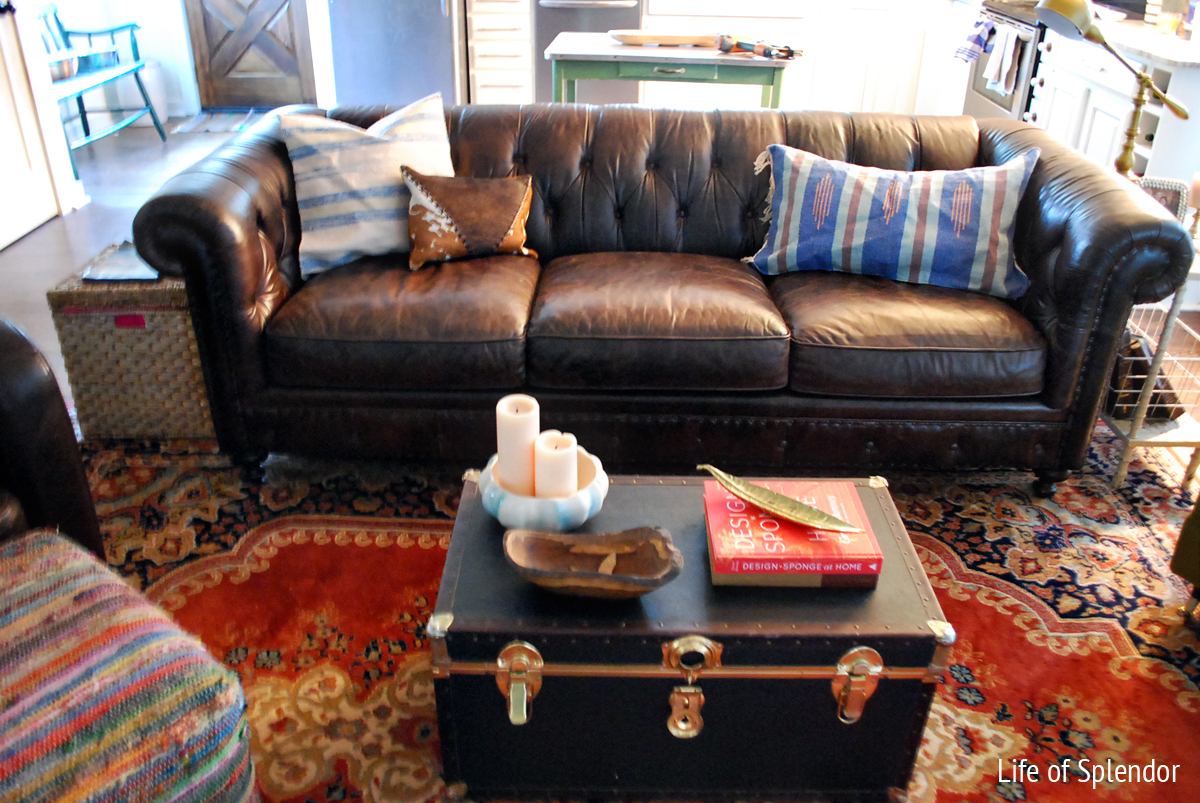 images of brown leather sofa and oriental rug