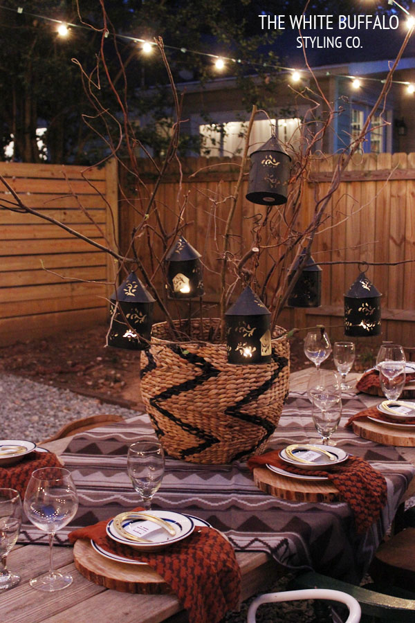 LANTERNS HANGING IN BRANCHES AS CENTERPIECE